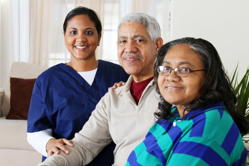 Home health care worker and an elderly couple